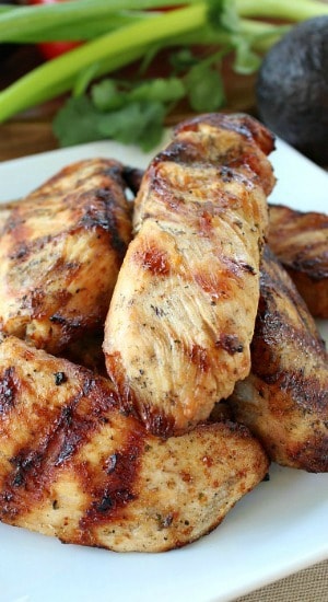 Awesome Chicken Burritos - picture of grilled chicken strips on a white plate.