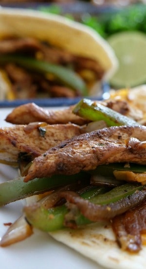 Chicken Fajitas - two tortillas with chicken, bell peppers, onions.