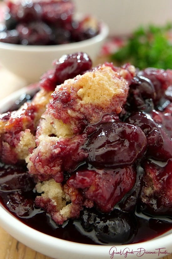 A white bowl filled with a serving of cobbler.