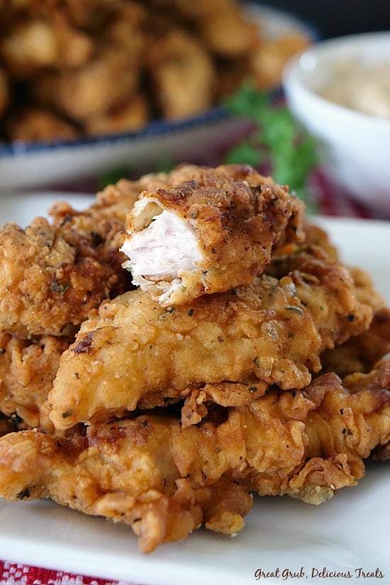 Chicken Fried Pork Fingers are delicious boneless pork fried to perfection and served with a side of country gravy.