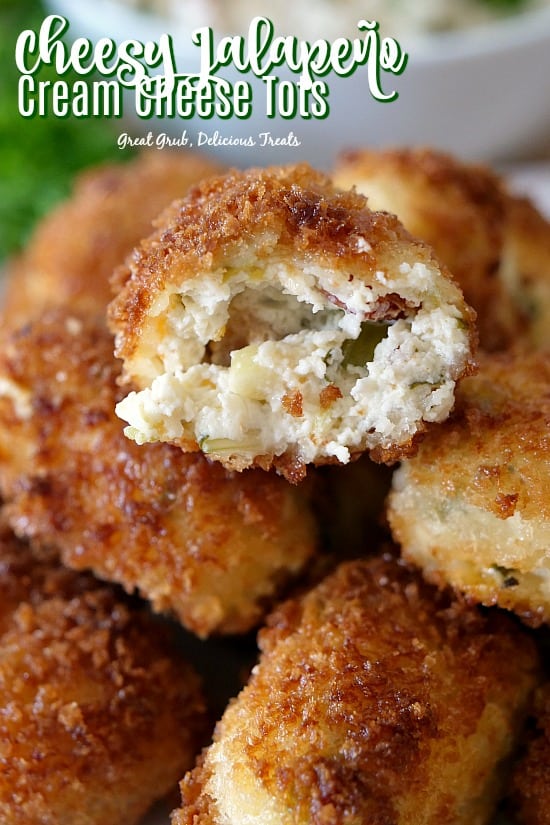 These Cheesy Jalapeno Cream Cheese Tots are loaded with bacon, cheese, cream cheese, onions, jalapenos, cilantro, seasoning and then fried. #friedfood #appetizers #tatertots #creamcheese #greatgrubdelicioustreats
