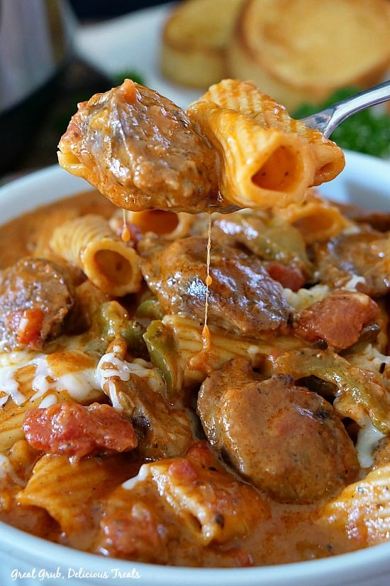 A forkful of sausage and pasta.