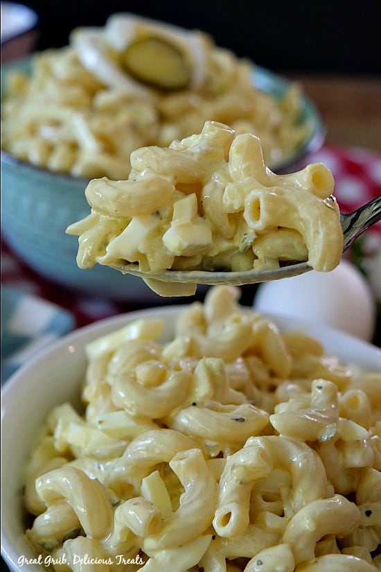 Deviled Egg Macaroni Salad is creamy, loaded with pasta, eggs, pickles and onions.