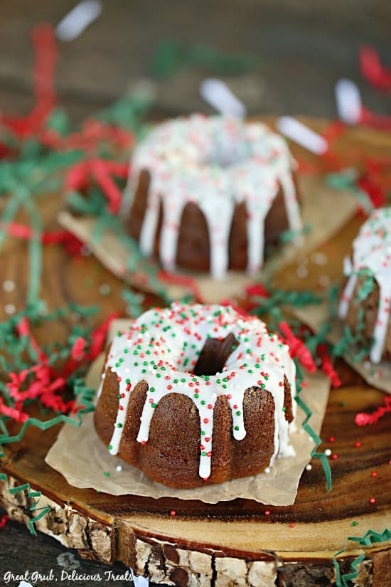 Gingerbread Mini Bundt Cakes are festive individual mini bundt cakes topped with icing and sprinkles.