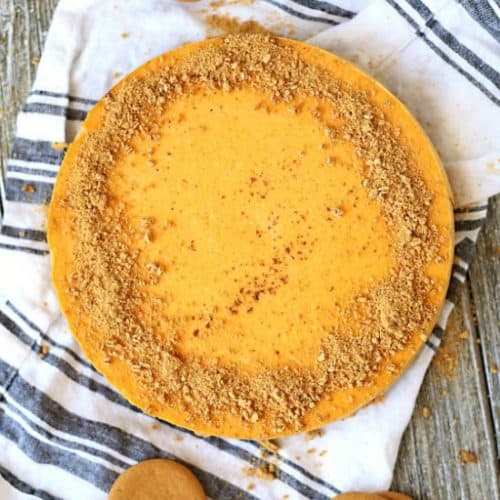 This pumpkin cheesecake has a gingersnap and shortbread cookie crust the filled with a pumpkin cream cheese filling.