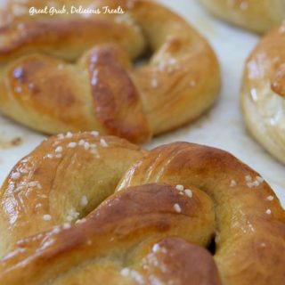 Homemade Soft Pretzels are delciously baked to a golden brown, topped with sea salt and brushed with melted butter.