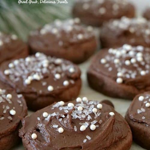 Chocolate Frosted Sugar Cookies are soft and chewy, frosted with chocolate frosting and sprinkles on top.