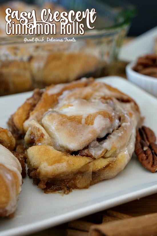 Easy Crescent Cinnamon Rolls are filled with a sugar, cinnamon, pecan mixture then drizzled with icing.