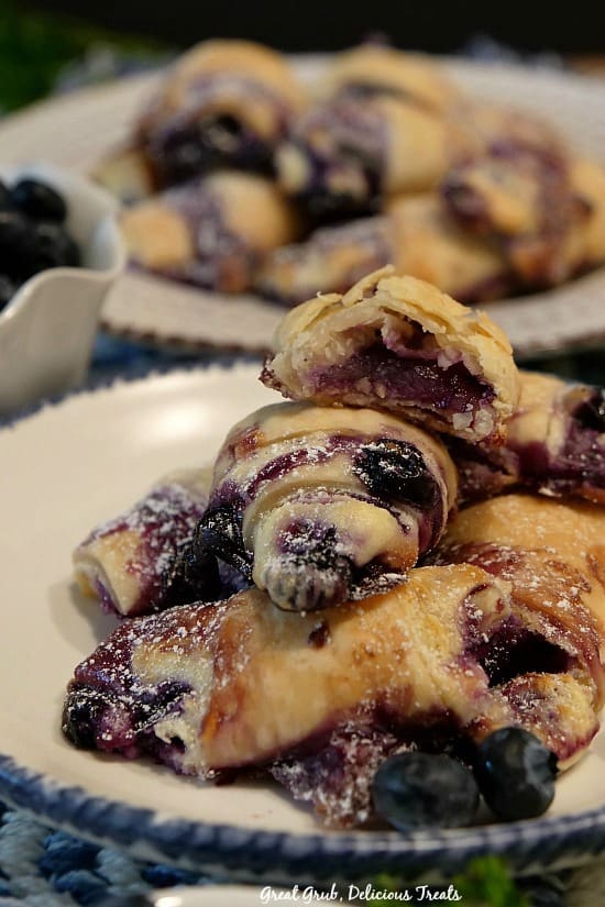 Blueberry Cream Cheese Bites are delicious hand held, flaky crescents like pie crust filled with blueberries and cheesecake.