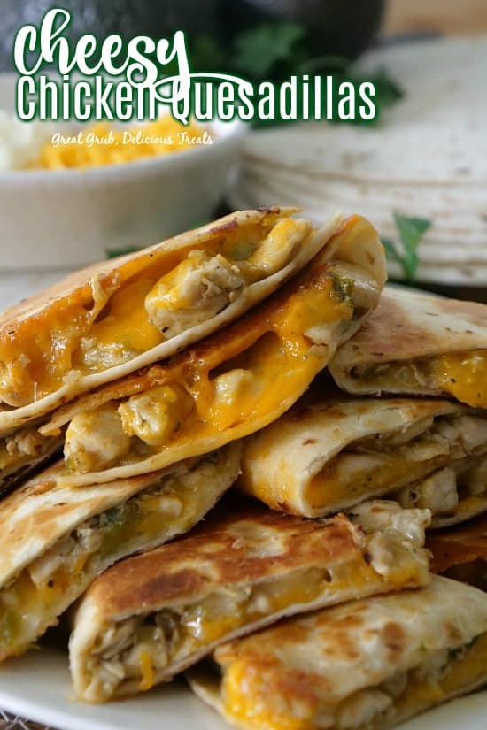 Cheesy Chicken Quesadillas cut into wedges full of two types of cheese.