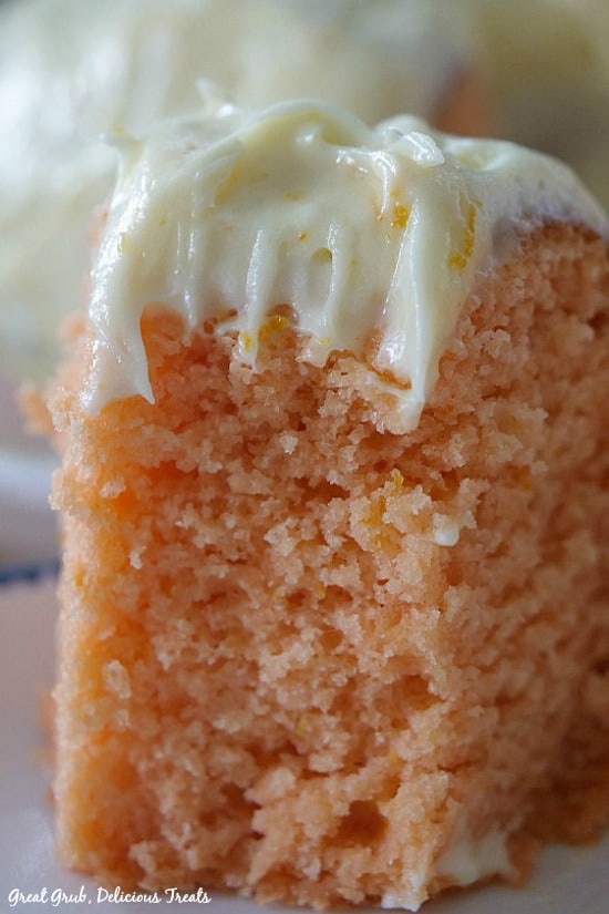 Orange Bundt Cake - a piece of orange cake with cream cheese frosting.