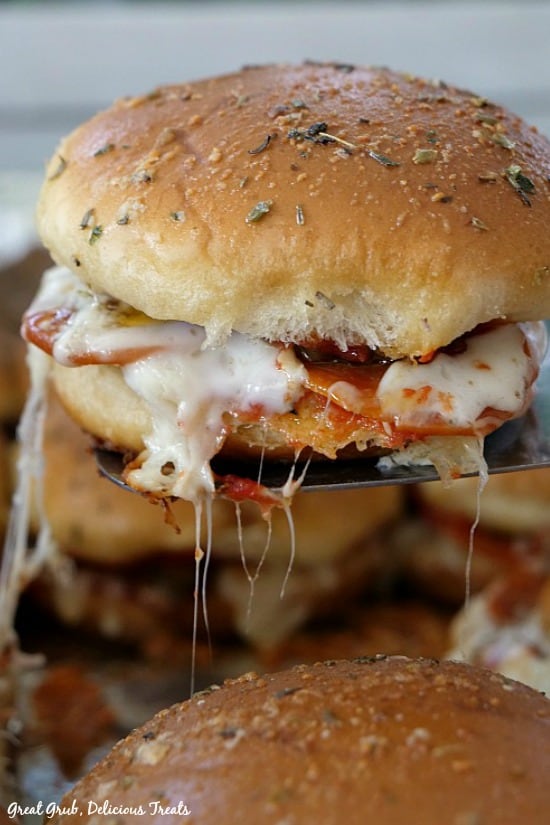 Pepperoni Sausage Pizza Sliders oozing with cheese, pepperoni and sausage.