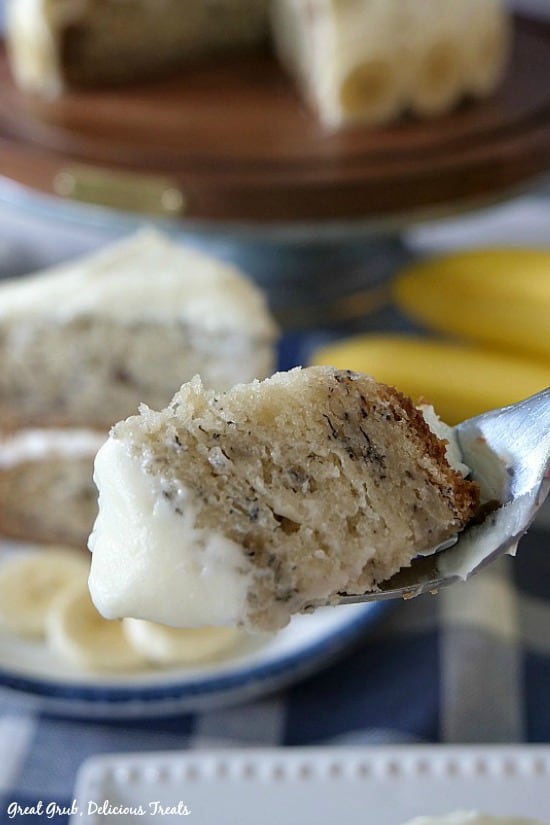 A bite of Banana Cake with Cream Cheese Frosting on a fork