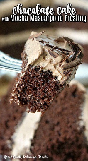 A close up photo of a bite of chocolate cake on a fork.