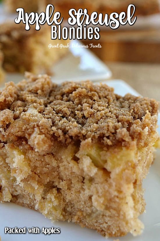 Apple Streusel Blondies - Two blondies sitting on white plates showing the streusel topping.