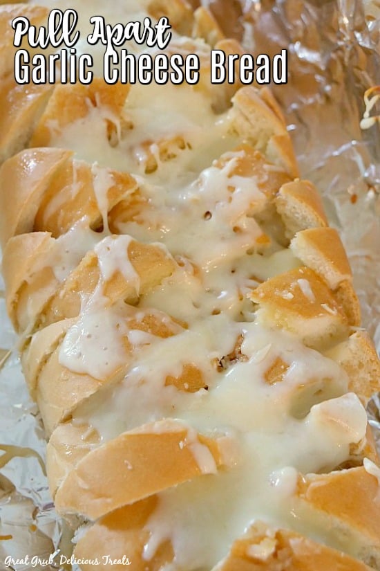 Pull Apart Garlic Cheese Bread - a French bread cut diagonally stuffed full of butter, garlic and melted mozzarella cheese.