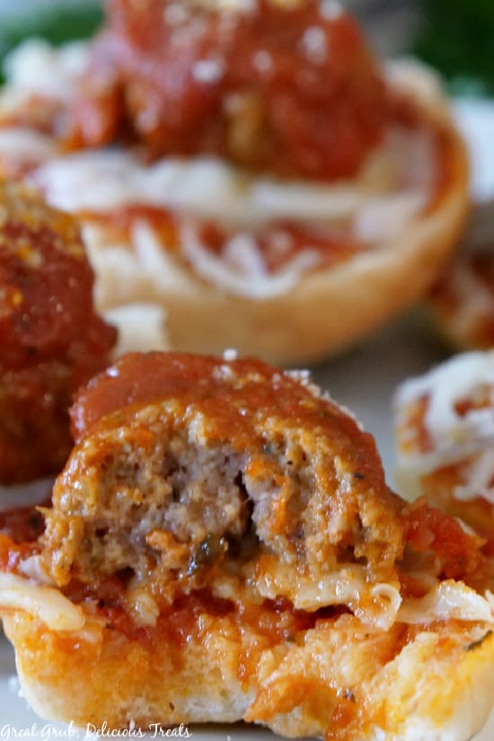 A close up picture of Meatball Bagel Bites with a bite taken out.