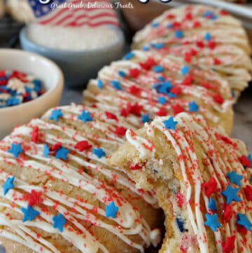Sugar Cookie Recipe is a delicious and patriotic cookie recipe decorated with red, white, and blue stars and red sprinkles.