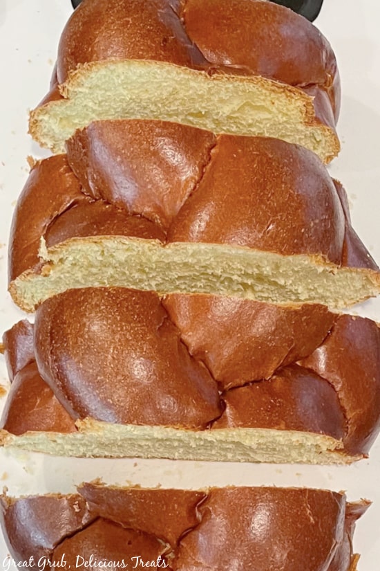 A loaf of Challah bread cut into 4 pieces for French Toast with Blueberry Topping