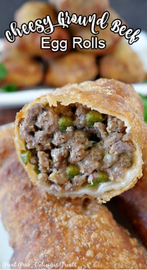 A close up photo of an egg roll with a bite taken out showing the meat mixture inside.
