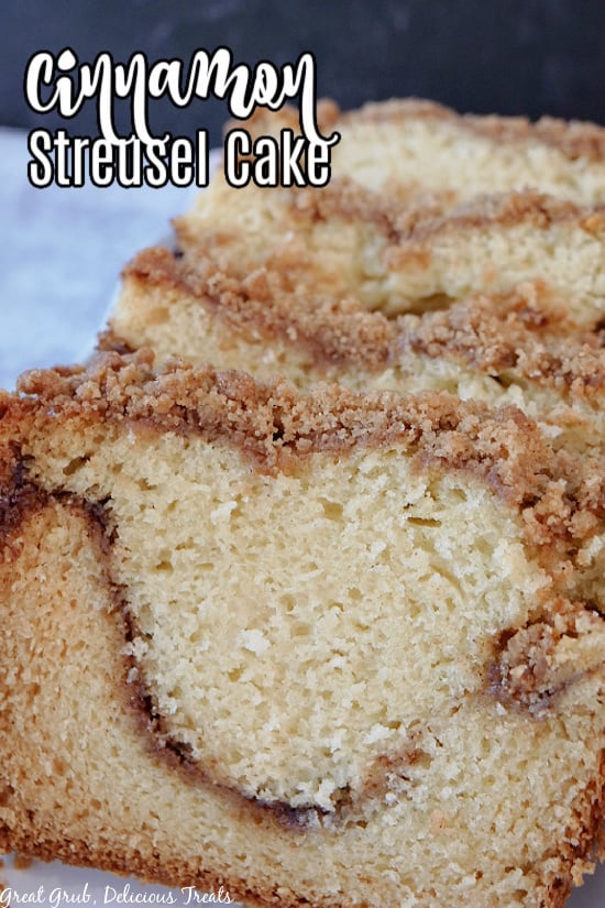 4 slices of Cinnamon Streusel Cake on a white plate.
