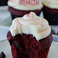 A close up photo of a red velvet cupcake with a bite taken out of it.