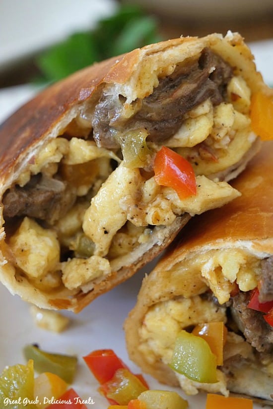 A super close up photo of the insides of a Beef Fajita Breakfast Burrito.