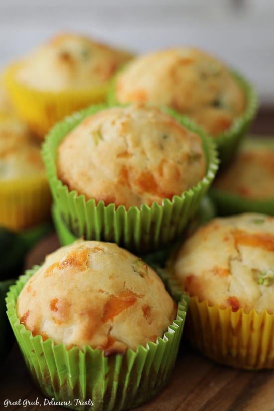 A close up picture of Jalapeno Cheese Muffins stacked on top of one another. 