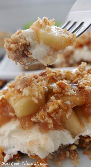 A close up photo of a piece of Apple Cinnamon Pretzel Salad with the title of the recipe on the top of the photo.