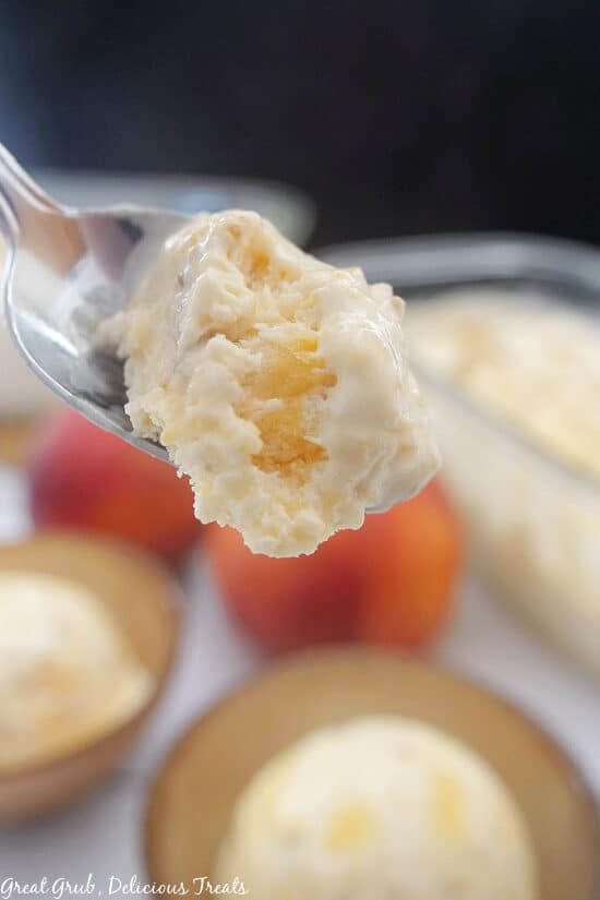 A close up of Peach Cobbler Frozen Dessert on a spoon.