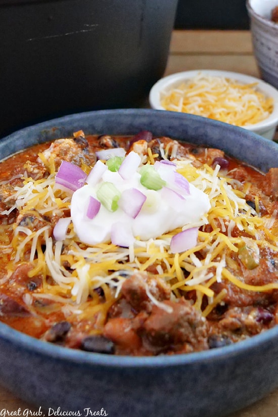 A close up photo of a gray bowl filled with chili.