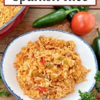 A white bowl with Spanish Rice in it and the title of the recipe is at the top of the photo.