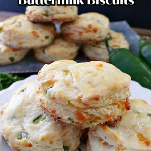 A white plate with 3 jalapeno cheddar buttermilk biscuits.