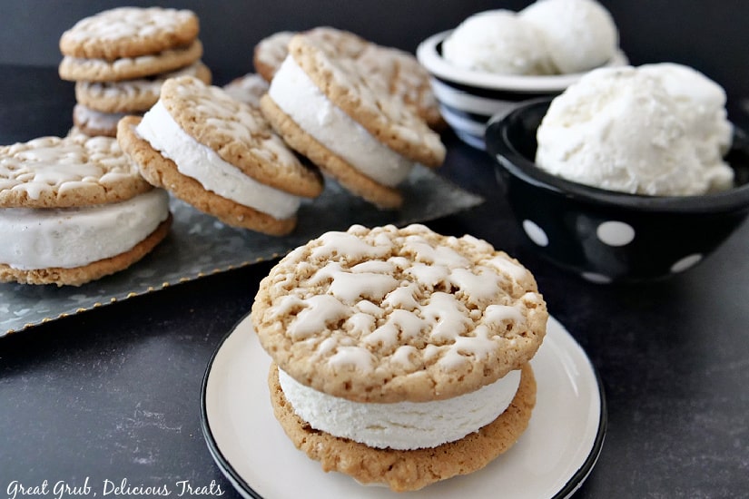 Easy Oatmeal Cookie Ice Cream Sandwiches with two black and white bowls filled with vanilla ice cream.