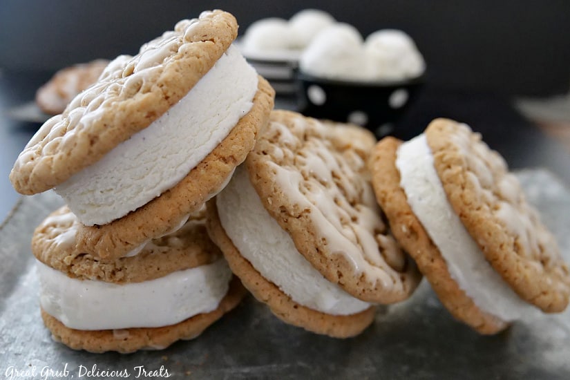 Four Oatmeal Cookie Ice Cream Sandwiches on a silver tray.