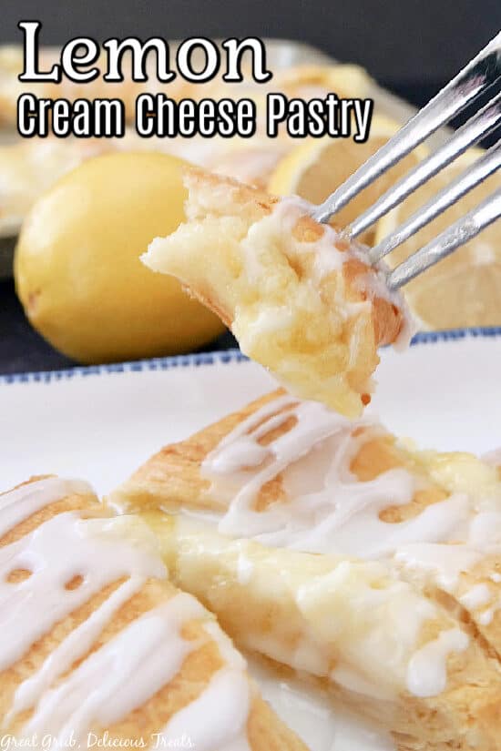 A close up of a bite on lemon pastry on a fork with the title of the recipe at the top of the photo.