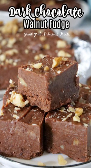 Three pieces of fudge on a small white plate.