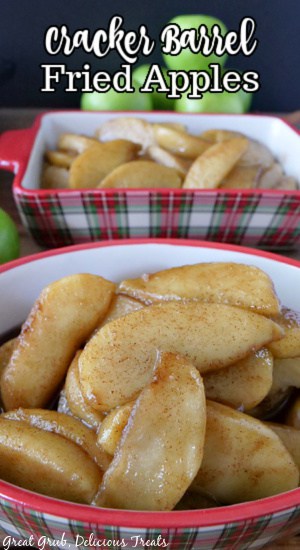 A close up of two red plaid baking dishes with fried apples in them.