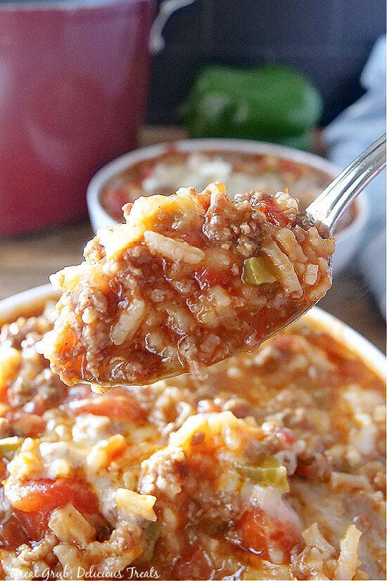 A close up photo of a spoonful of stuffed pepper soup.