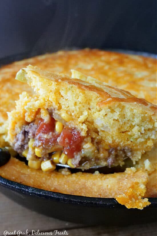 A close up picture of Tamale Pie in a cast iron pan.