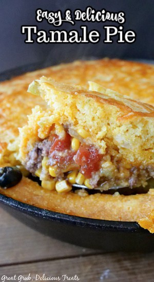 A spoonful of Tamale Pie being taken out of the cast iron pan with the title at the top.