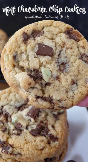 A close up photo of a cookie with chocolate chips and Andes mint baking chips.
