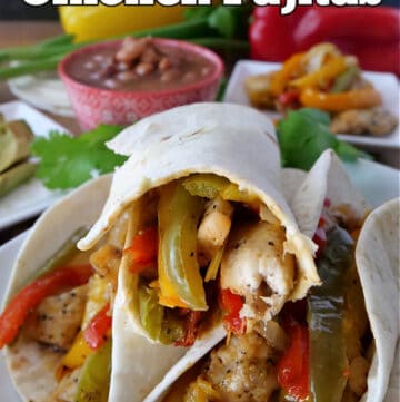 Three chicken fajitas stacked on a white plate, all filled with chicken, onions, and different colored bell peppers.