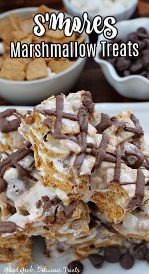 Two marshmallow treats made with S'mores cereal on a white plate.