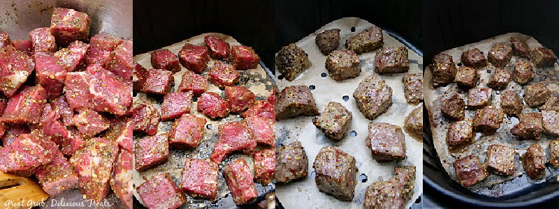 An in process shot of raw steak bites in an air fryer basket.