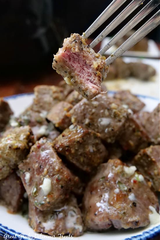 A steak bite on a fork.
