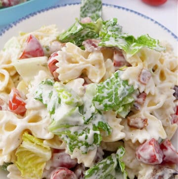 A large serving bowl filled with delicious BLT pasta salad.