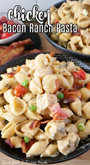 A black serving bowl with chicken bacon ranch pasta in it.