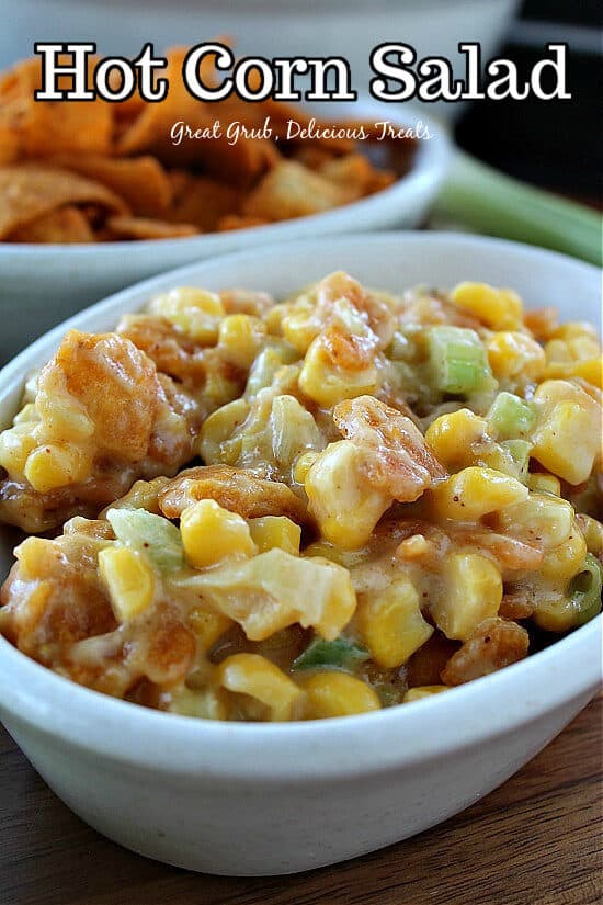 A white oval bowl filled with hot corn salad.