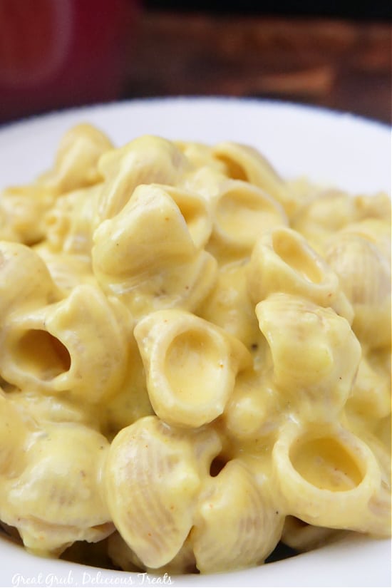A close up photo of mac and cheese, showing the creamy texture.